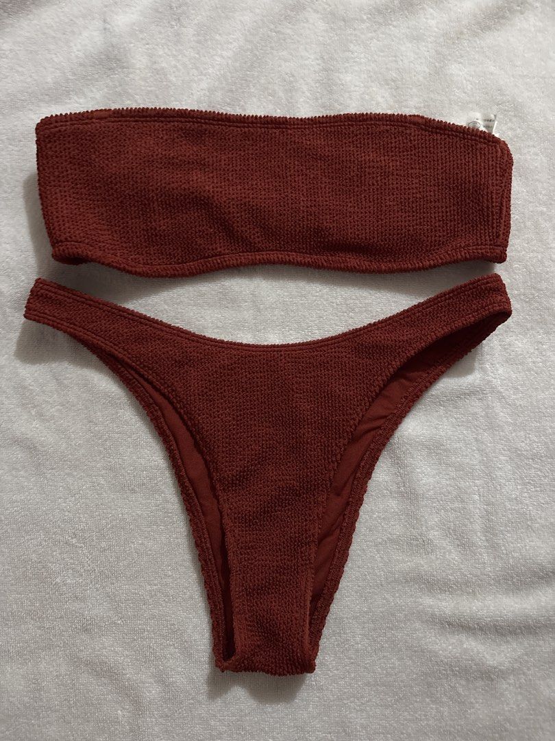 Rust-colored Textured Bikini Set (Category: Bikinis & Swimsuits) located in Makati City. Submitted by ell_declutter (Listing ID 1435383786, Image 1). Description: Bikini set features a bandeau top and high-cut bottoms in a rich rust color. The fabric has a textured appearance. Perfect for your next beach trip or poolside relaxation..