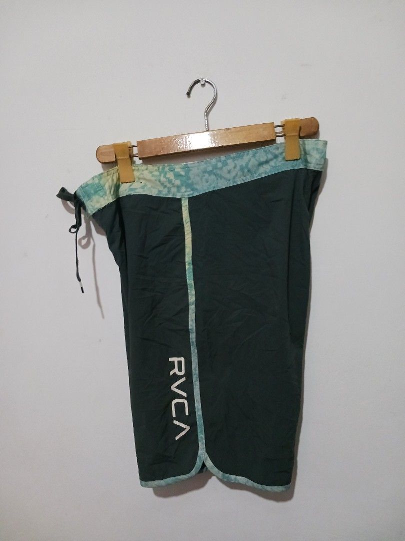 RVCA Board Shorts Size 34 (Category: Shorts) located in Subic. Submitted by thriftpoison (Listing ID 1435430663, Image 1). Description: - RVCA board shorts - Dark green color - Size 34 W 34 L 21 - Patterned waistband and trim - RVCA logo on leg - Back pocket - Drawstring closure.