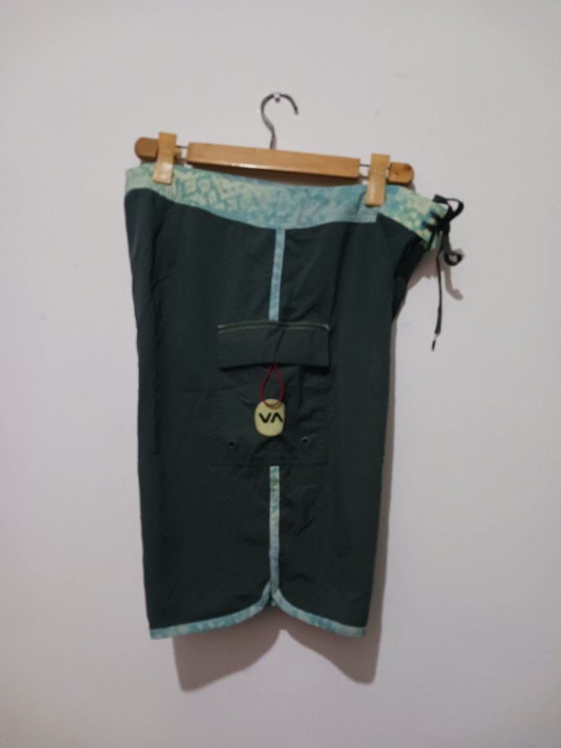 RVCA Board Shorts Size 34 (Category: Shorts) located in Subic. Submitted by thriftpoison (Listing ID 1435430663, Image 2). Description: - RVCA board shorts - Dark green color - Size 34 W 34 L 21 - Patterned waistband and trim - RVCA logo on leg - Back pocket - Drawstring closure.