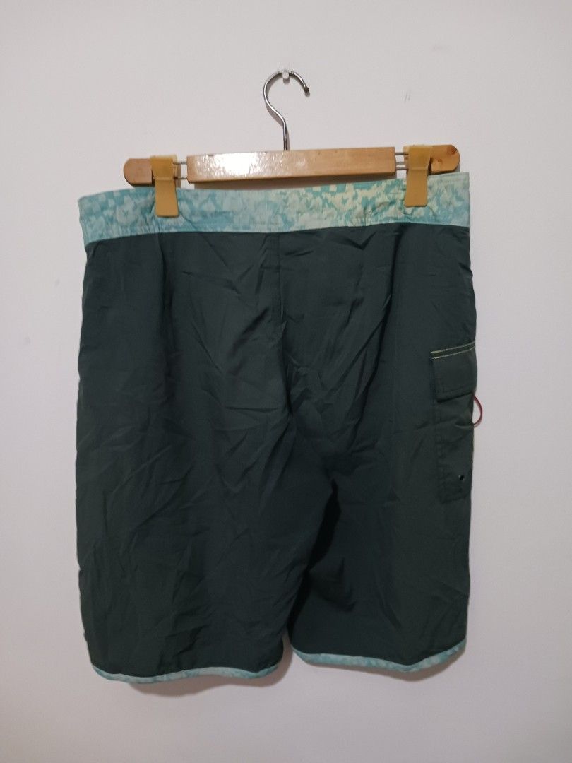 RVCA Board Shorts Size 34 (Category: Shorts) located in Subic. Submitted by thriftpoison (Listing ID 1435430663, Image 3). Description: - RVCA board shorts - Dark green color - Size 34 W 34 L 21 - Patterned waistband and trim - RVCA logo on leg - Back pocket - Drawstring closure.