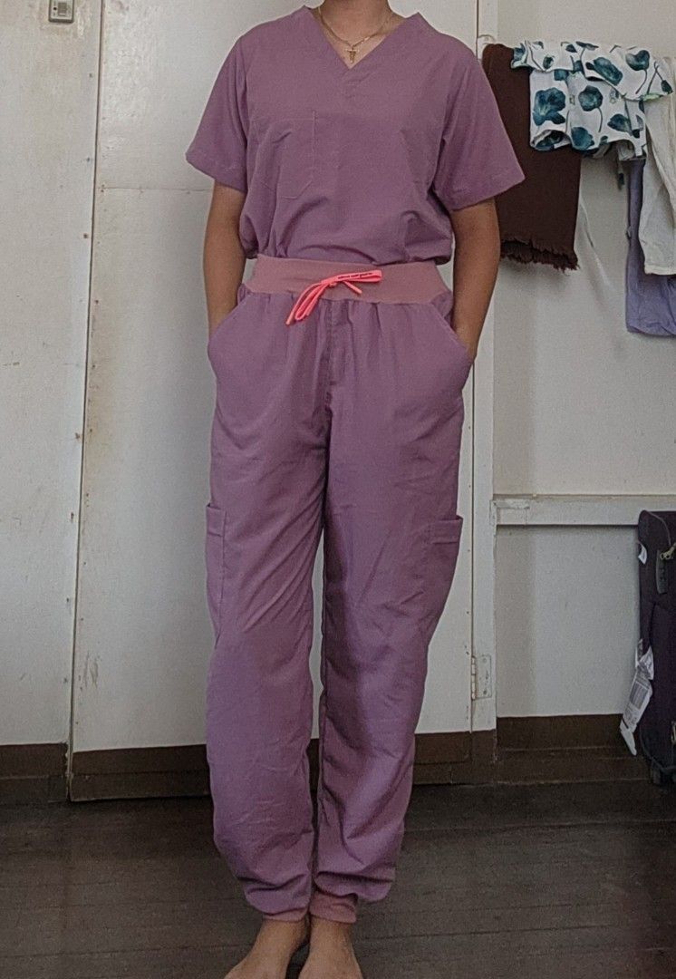Scrub Suit - Lavender (Category: Sets or Coordinates) located in Lingayen. Submitted by brulee21 (Listing ID 1435386953, Image 1). Description: - SD Easy Wear Lavender Scrub Suit - Includes V-neck top with chest pocket - Cargo pants with drawstring waist - Pants have side pockets and cuffed ankles - large size fits (L-XL) - Made of lightweight material RFS: too big or wrong size sizing down for reference: model height: 5'6" wt:67kg.