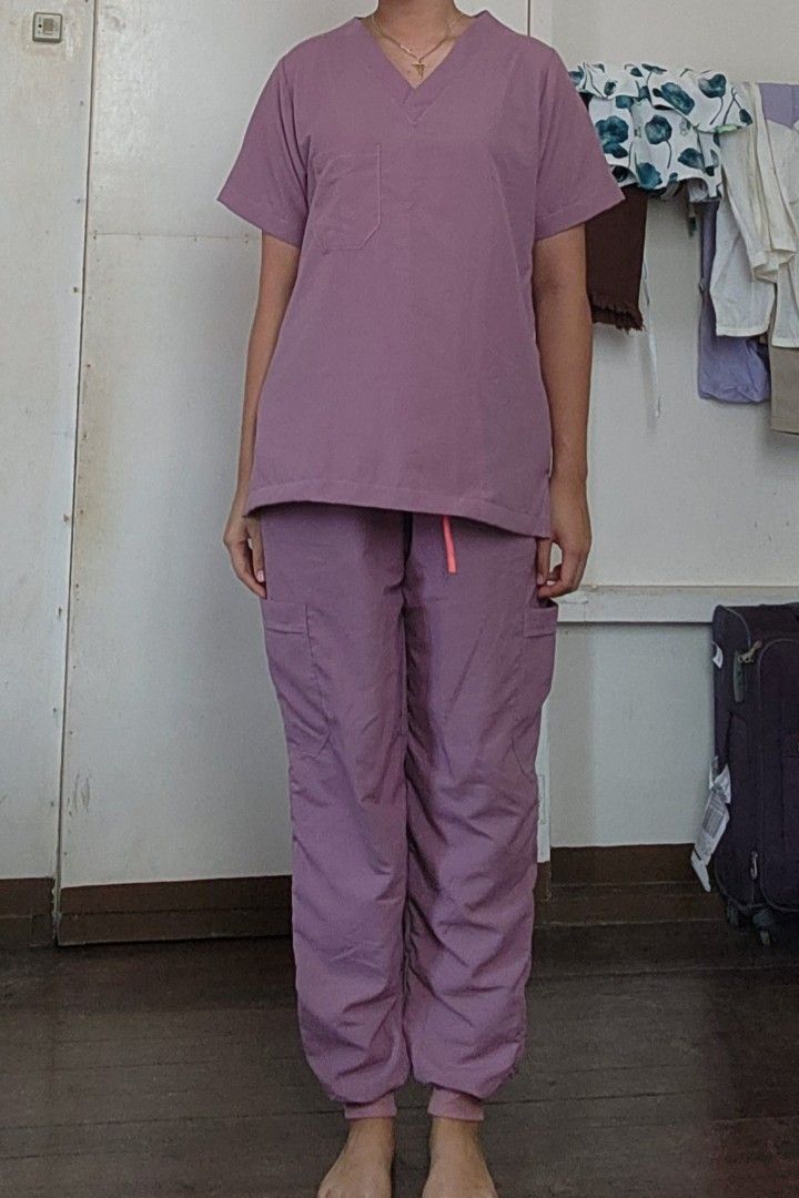 Scrub Suit - Lavender (Category: Sets or Coordinates) located in Lingayen. Submitted by brulee21 (Listing ID 1435386953, Image 2). Description: - SD Easy Wear Lavender Scrub Suit - Includes V-neck top with chest pocket - Cargo pants with drawstring waist - Pants have side pockets and cuffed ankles - large size fits (L-XL) - Made of lightweight material RFS: too big or wrong size sizing down for reference: model height: 5'6" wt:67kg.