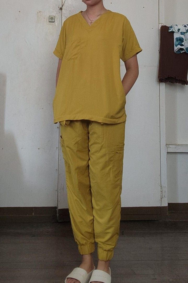 Scrub Suit - Mustard (Category: Sets or Coordinates) located in Lingayen. Submitted by brulee21 (Listing ID 1435387368, Image 2). Description: - SD Easy Wear Mustard Scrub Suit - V-neck top with chest pocket - Pants with drawstring waist, pockets, and elastic cuffs - Made from cotton mild stretch fabric - Size chart available in images rfs: sizing down reference: model stands 5'6" and 67kg.