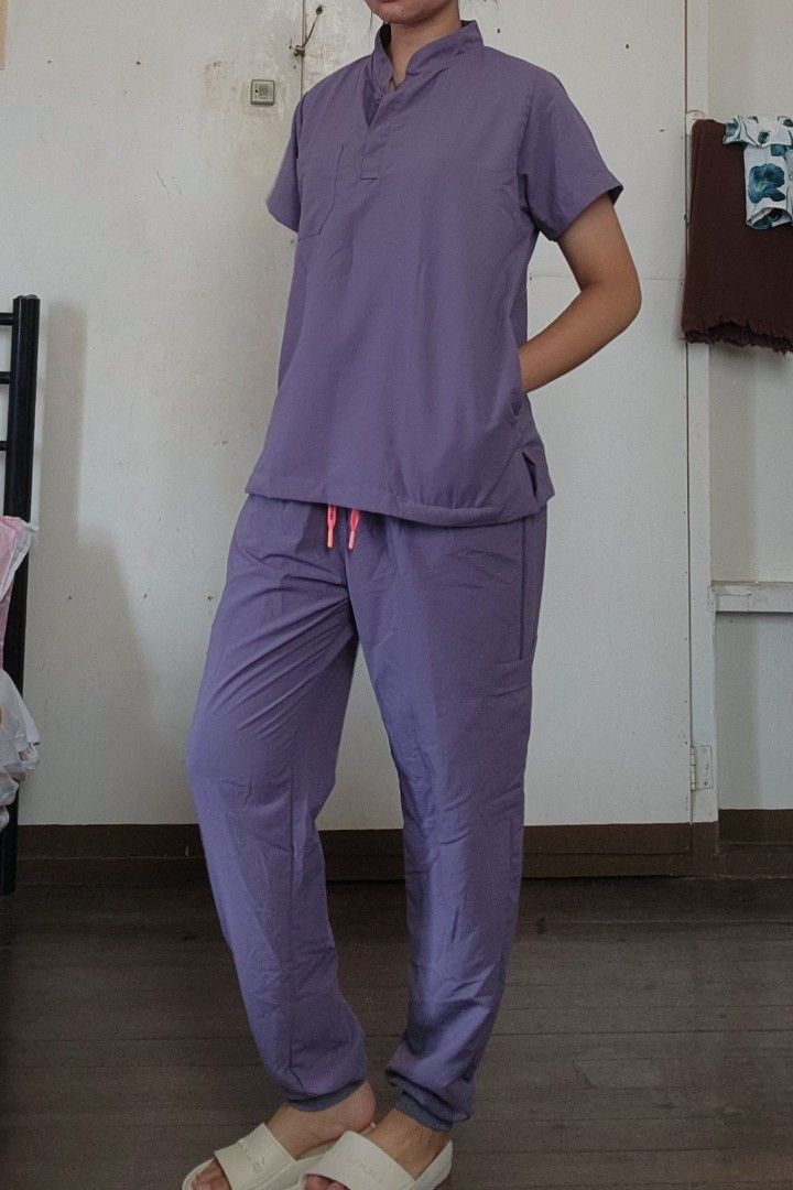 Scrubs Suit Mandarin Collar (Category: Sets or Coordinates) located in Lingayen. Submitted by brulee21 (Listing ID 1435387929, Image 2). Description: - Purple scrub suit - Mandarin collar - large size - Top: - Short sleeves - Pocket - Pants: - Slim fit - Drawstring waist (pink) rfs: sizing down reference: model stand 5'6 and 67kg.