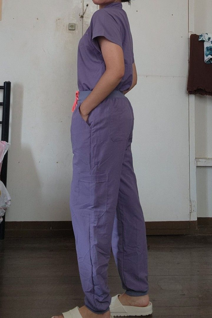 Scrubs Suit Mandarin Collar (Category: Sets or Coordinates) located in Lingayen. Submitted by brulee21 (Listing ID 1435387929, Image 3). Description: - Purple scrub suit - Mandarin collar - large size - Top: - Short sleeves - Pocket - Pants: - Slim fit - Drawstring waist (pink) rfs: sizing down reference: model stand 5'6 and 67kg.