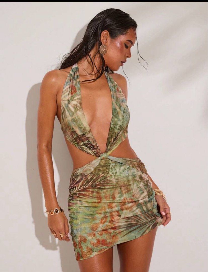 Sexy Halter Neck Mini Dress (Category: Dresses) located in Quezon City. Submitted by theoddyeti (Listing ID 1435492715, Image 1). Description: Used only once.. purchased at 1k selling low to 300 - Halter neck mini dress - Cutout detail at waist - Ruched skirt - Tropical print - Sleeveless - Low back - Ideal for beach or summer wear.