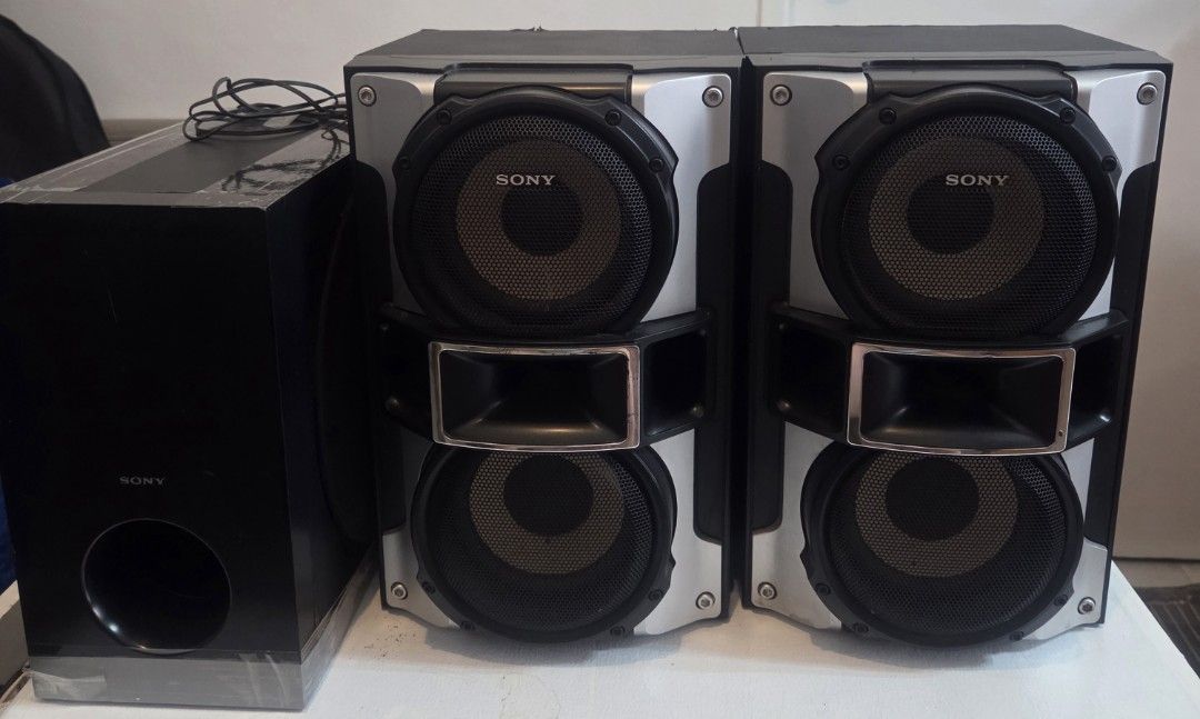 Sony Speaker System with Subwoofer (Category: Soundbars, Speakers & Amplifiers) located in Manila. Submitted by brendamoreno (Listing ID 1435347898, Image 1). Description: - Sony speaker system with subwoofer - Includes two main speakers and a separate subwoofer - Stylish black and silver design - Comes with all necessary cables.