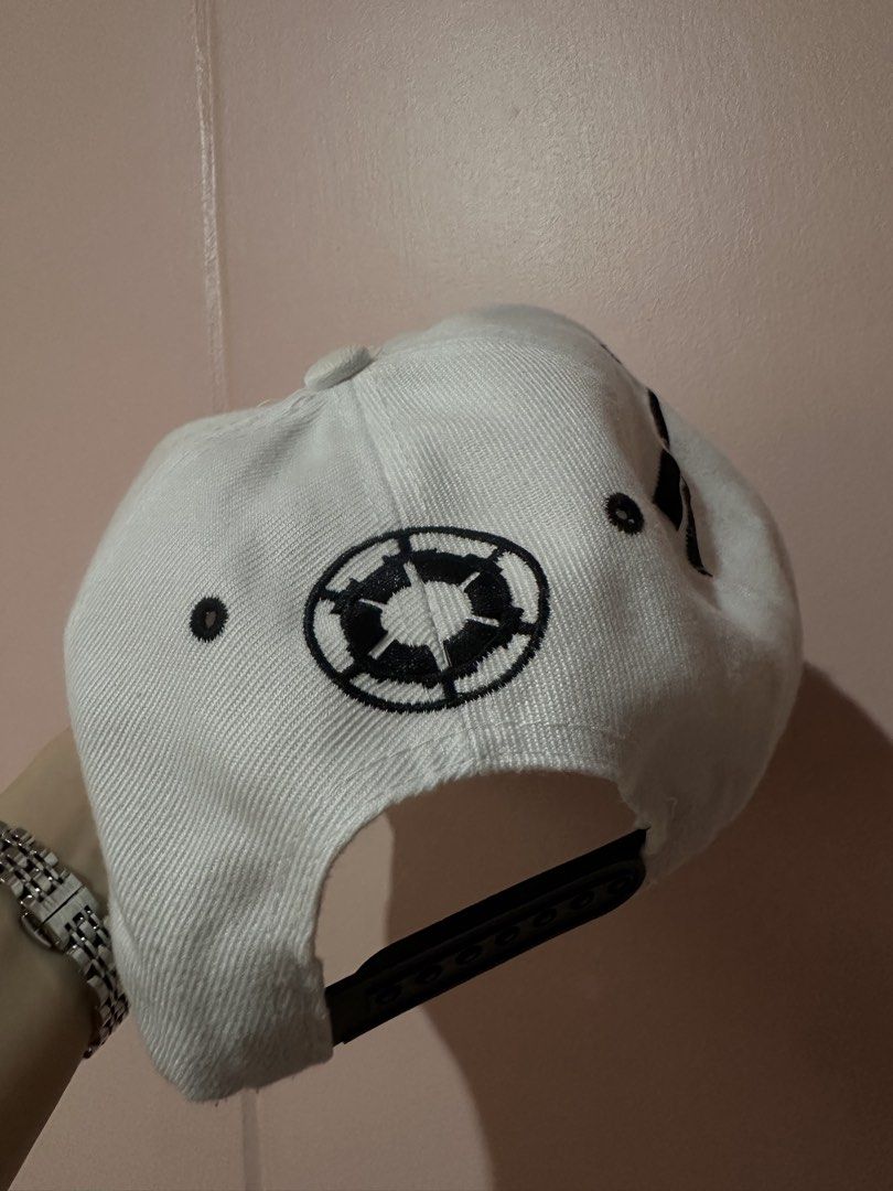 Star Wars Stormtrooper Cap (Category: Caps & Hats) located in Caloocan City. Submitted by kween.of.decluttering (Listing ID 1435415055, Image 3). Description: - Star Wars Stormtrooper Cap - Features a Stormtrooper design on the front - "TROOPER" print on the underside of the brim - Star Wars logo on the back - Flat brim - Snapback closure - Color: White with black and grey accents.