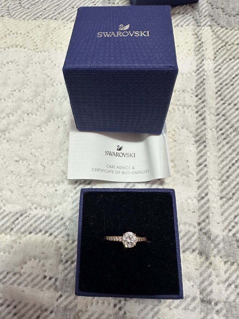 Swarovski Ring (Category: Rings) located in Pasig City. Submitted by sandy120913 (Listing ID 1435417706, Image 1). Description: - Authentic Swarovski ring - Rose gold color - Sparkling clear stone - Includes: - Original box - Receipt - Certificate of authenticity - Care advice - Ring size: 58.