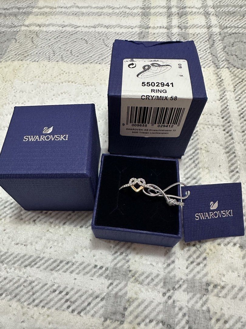 Swarovski Ring 5502941 CRY/MIX 58 (Category: Rings) located in Pasig City. Submitted by sandy120913 (Listing ID 1435420789, Image 1). Description: - Authentic Swarovski ring - Heart design with crystals and gold-tone accents - Ring size: 58 - Includes original box, tag, and packaging - Perfect for gifting or collecting.