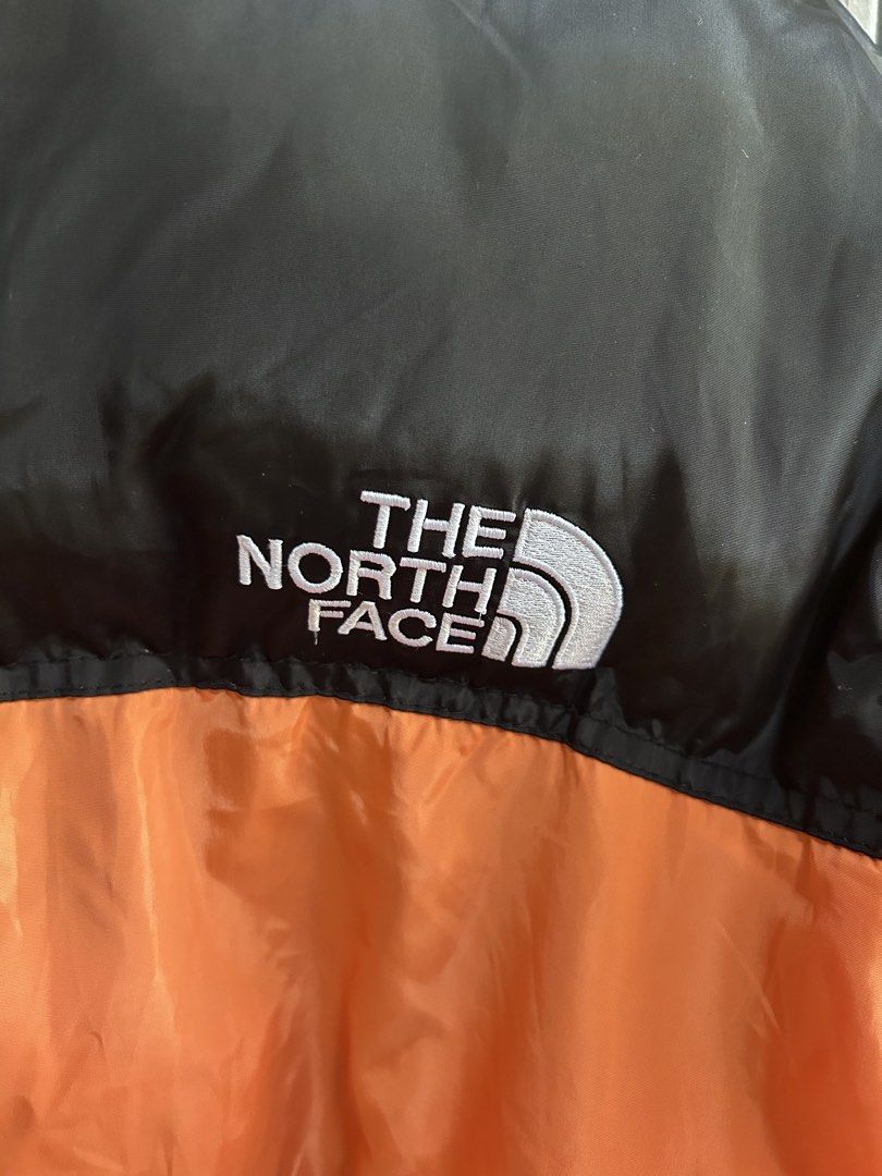 The North Face 700 Orange Puffer Jacket XL (Category: Coats, Jackets and Outerwear) located in Malasiqui. Submitted by blckfourthrift (Listing ID 1435384371, Image 3). Description: Northface 700 Orange XL on tag 24x28.5 Issue/s: Dot holes (didn't go through), Stains, Replaced zipper pullers 1200 negotiable.