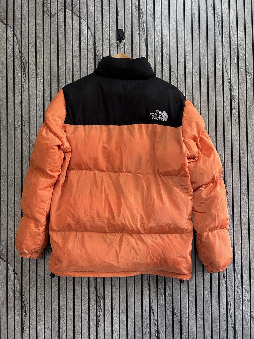 The North Face 700 Orange Puffer Jacket XL (Category: Coats, Jackets and Outerwear) located in Malasiqui. Submitted by blckfourthrift (Listing ID 1435384371, Image 2). Description: Northface 700 Orange XL on tag 24x28.5 Issue/s: Dot holes (didn't go through), Stains, Replaced zipper pullers 1200 negotiable.