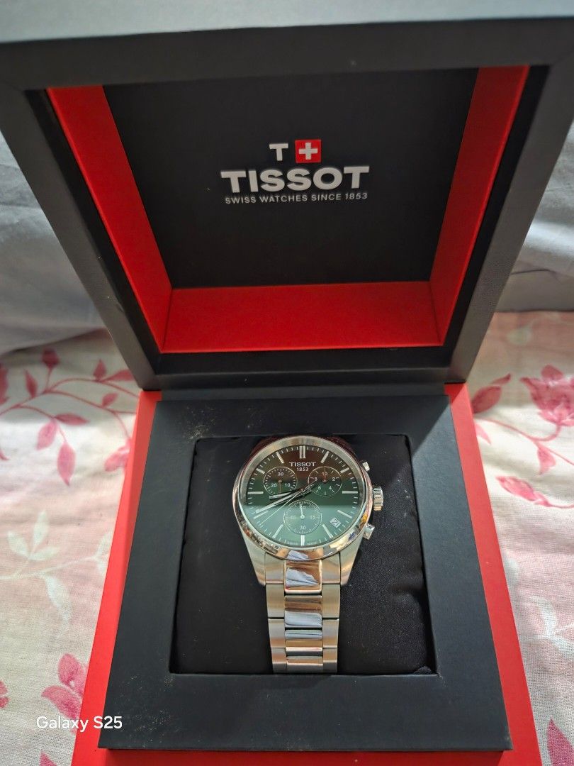 Tissot Chronograph Watch (Category: Luxury Watches) located in Dasmarinas. Submitted by beab4th.beab4th (Listing ID 1435463270, Image 3). Description: - Tissot watch - Green dial - Stainless steel bracelet - Chronograph subdials - Date display - Includes original box and tag - Tag price: USD 375 - Perfect for everyday wear.