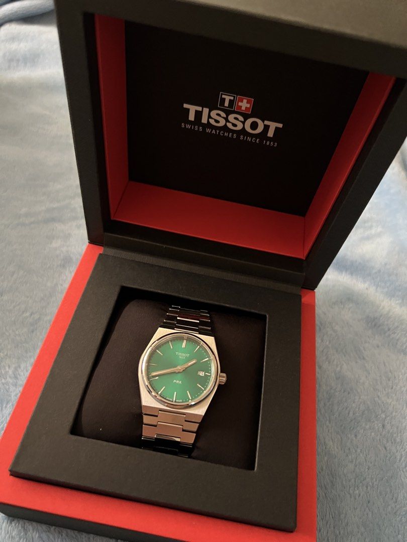 Tissot PRX Green Dial Watch (Category: Luxury Watches) located in Binan City. Submitted by thetidyqueen (Listing ID 1435377495, Image 1). Description: - Tissot PRX watch - Striking green dial - Stainless steel bracelet - Comes with original box - Sleek, modern design - Silver-tone hands and markers - Stylish accessory for everyday wear PRX T137410A Green Dial Just item + box, no other inclusions.