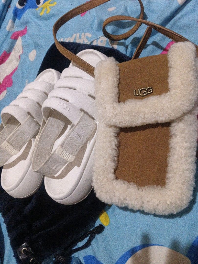 UGG Sport Yeah Slide Bright White US 10W (Category: Flats & Sandals) located in Cabanatuan. Submitted by bagsyoulove (Listing ID 1435407061, Image 2). Description: with ugg sling bag set - UGG Sport Yeah Slides - Color: Bright White - Size: US 10W - Features: White strap, thick sole - Condition: Good - Includes: Small brown bag with white fur trim and UGG logo.