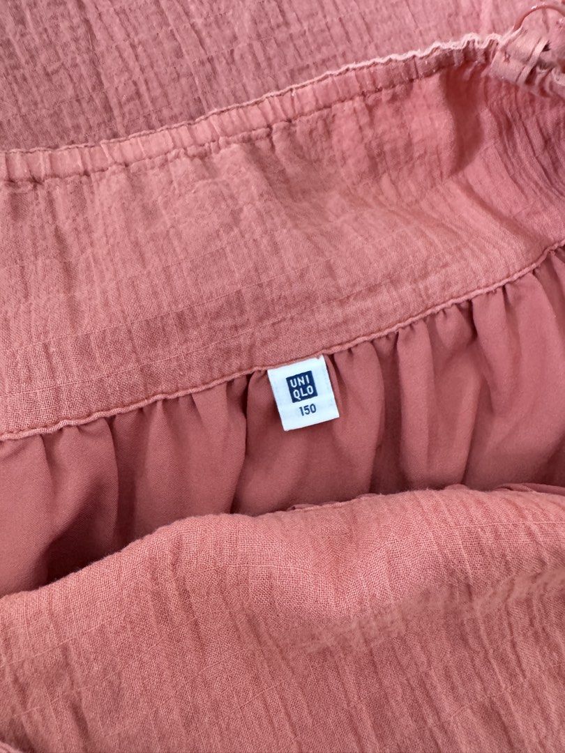 Uniqlo Dress - Size 150 (Category: Dresses) located in Cabanatuan. Submitted by thearchivemuse (Listing ID 1435359473, Image 2). Description: - Uniqlo dress - Size 150 - Spaghetti strap design - Flowing, loose fit - Solid reddish-pink color - Textured, slightly crinkled fabric - Perfect for casual wear.