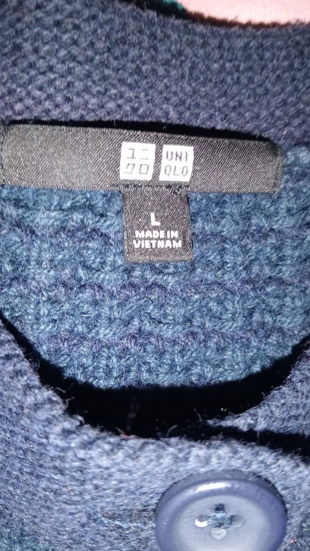 Uniqlo Navy Cardigan - Size L (Category: Coats, Jackets and Outerwear) located in Quezon City. Submitted by char_vea (Listing ID 1435351987, Image 2). Description: - Uniqlo navy cardigan - Size: L - Features a button-down front - Long sleeves - Made in Vietnam - Textured knit design.