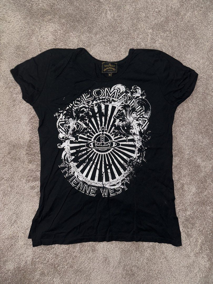 Vivienne Westwood Black Graphic Tee (Category: Shirts) located in Manila. Submitted by 1eojnx (Listing ID 1435455299, Image 1). Description: - Black Vivienne Westwood t-shirt - Graphic print on front - Crew neck - Short sleeves - Includes "Vivienne Westwood" and "SOLOMAN" print - Tag visible at the back of the neck.