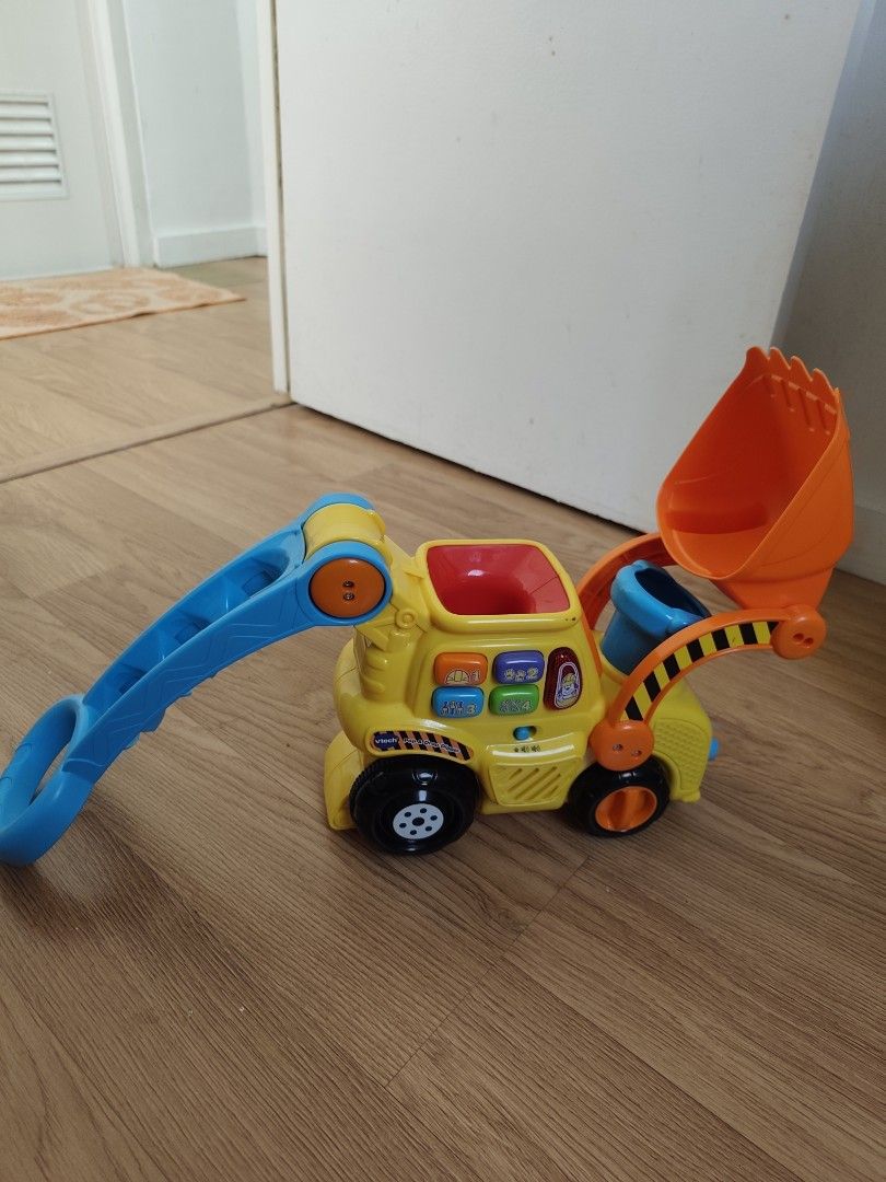 Vtech Push & Pop Bulldozer (Category: Infant Playtime) located in Cavite. Submitted by mdrjtb (Listing ID 1435394284, Image 1). Description: Working Lights, Sounds & in good condition. Battery not included..