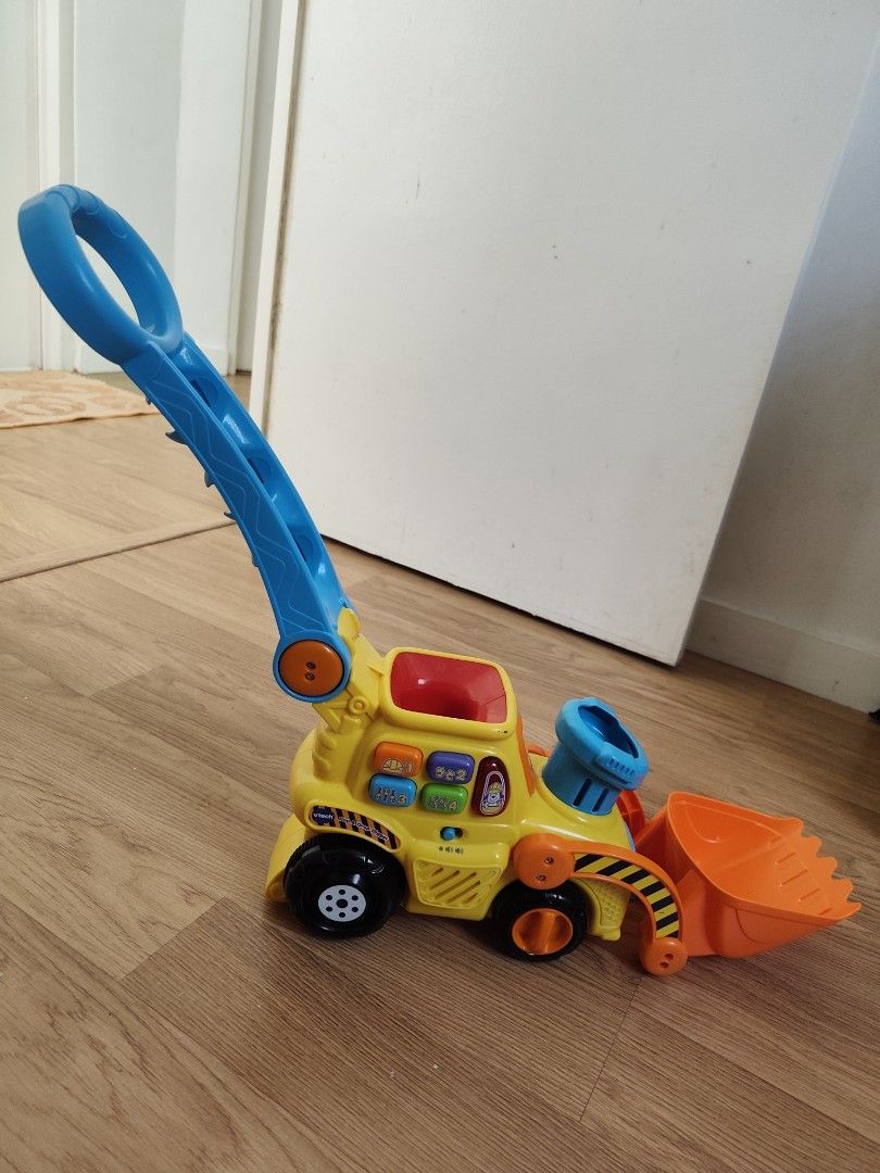 Vtech Push & Pop Bulldozer (Category: Infant Playtime) located in Cavite. Submitted by mdrjtb (Listing ID 1435394284, Image 2). Description: Working Lights, Sounds & in good condition. Battery not included..