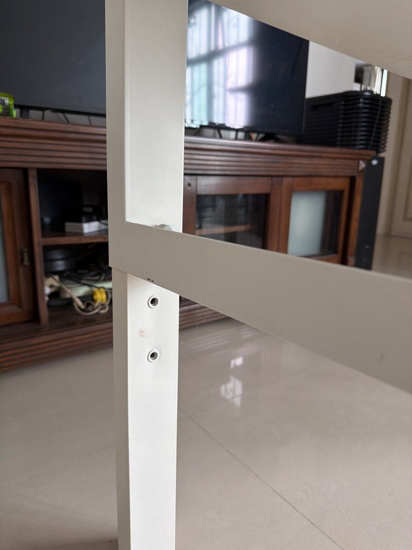 White Rectangular Table (Category: Tables & Sets) located in Singapore. Submitted by yy551177 (Listing ID 1435435866, Image 3). Description: - White rectangular table - Sturdy and functional - Suitable for small spaces - Some wear and tear (see photos) -128cm x 58cm - adjustable height .