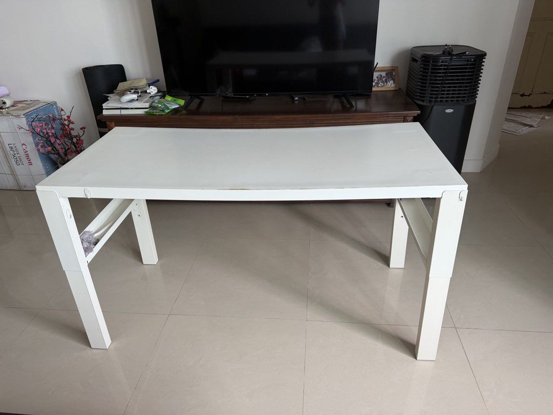 White Rectangular Table (Category: Tables & Sets) located in Singapore. Submitted by yy551177 (Listing ID 1435435866, Image 2). Description: - White rectangular table - Sturdy and functional - Suitable for small spaces - Some wear and tear (see photos) -128cm x 58cm - adjustable height .