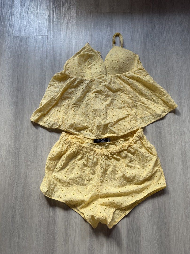 Woman Sleepwear Yellow Eyelet Set (Category: Undergarments & Loungewear) located in Quezon City. Submitted by confessionsofshopaholics (Listing ID 1435456605, Image 1). Description: - Woman Sleepwear yellow eyelet set - Includes halter top with ruffled design - Shorts feature an elastic waistband - Made of lightweight fabric - Ideal for warm weather.