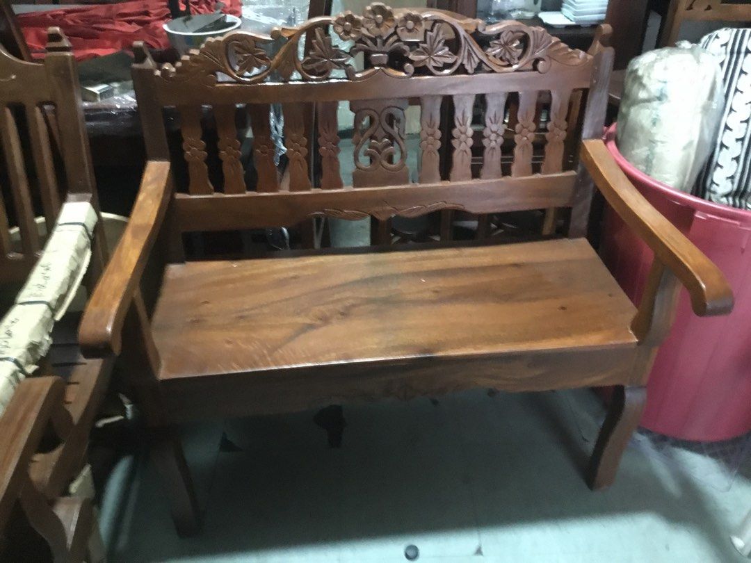 Wooden Bench with Carved Backrest (Category: Chairs) located in Manila. Submitted by roberto.enriquez (Listing ID 1435409108, Image 1). Description: - Wooden bench with intricate carvings - Features armrests - Rich, warm wood tone - Sturdy and well-constructed - Suitable for indoor use - Classic design Length 39 Width 19 inches Height 40.