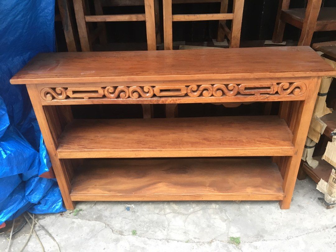 Wooden Console Table with Shelves (Category: Tables & Sets) located in Manila. Submitted by roberto.enriquez (Listing ID 1435429520, Image 1). Description: - Wooden console table - Three shelves for storage - Decorative carved design - Natural wood finish - Ideal for entryways, living rooms, or hallways - Sturdy and classic design Length 57 Width 14 inches Height 35.