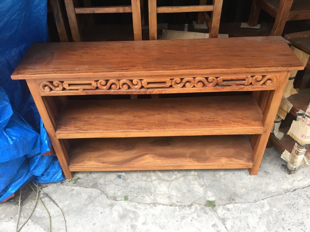 Wooden Console Table with Shelves (Category: Tables & Sets) located in Manila. Submitted by roberto.enriquez (Listing ID 1435429520, Image 3). Description: - Wooden console table - Three shelves for storage - Decorative carved design - Natural wood finish - Ideal for entryways, living rooms, or hallways - Sturdy and classic design Length 57 Width 14 inches Height 35.