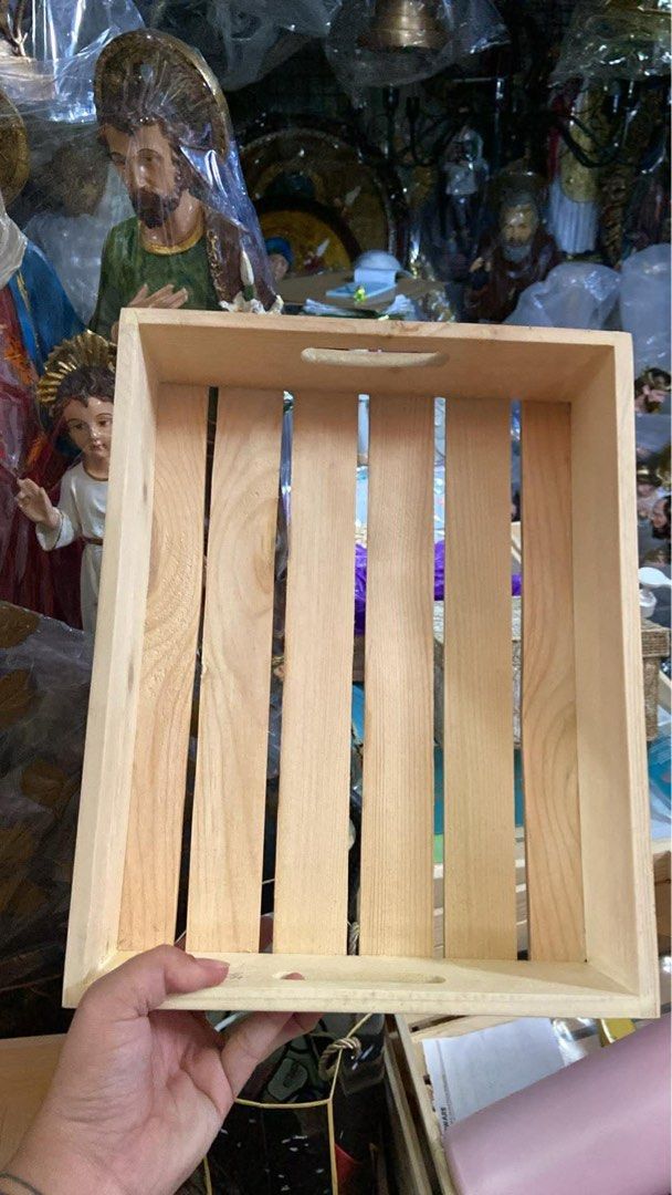 Wooden Crate (Category: Storage Boxes & Baskets) located in Quezon City. Submitted by ivy191995 (Listing ID 1435475005, Image 1). Description: - Wooden crate - Rectangular shape - Vertical slats - Handle for carrying - Natural wood color - Perfect for storage or display - Ideal for home or shop.