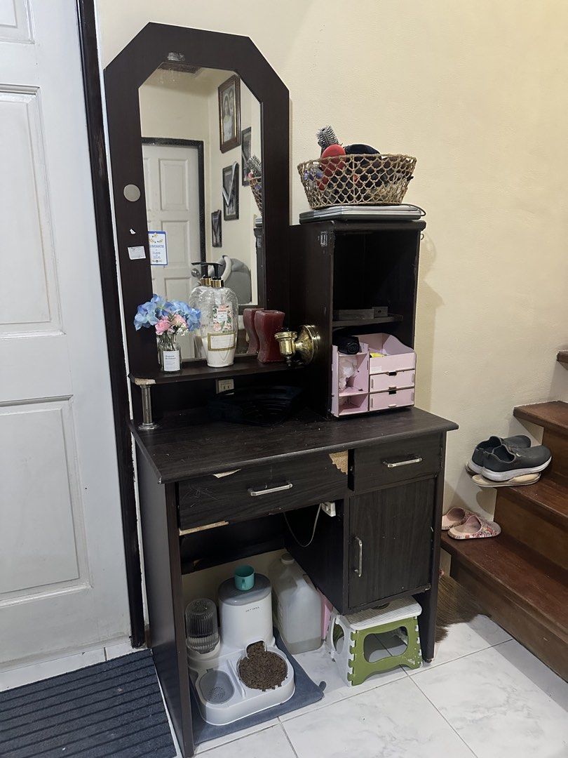Wooden Dressing Table with Mirror (Category: Tables & Sets) located in Paranaque City. Submitted by moonbea (Listing ID 1435454218, Image 2). Description: - things inside not included -Wooden dressing table with mirror - Includes a drawer, cabinet, and shelves for storage - Dark brown finish - Built-in mirror - Additional side storage - Built in lamp (changeable bulb) .