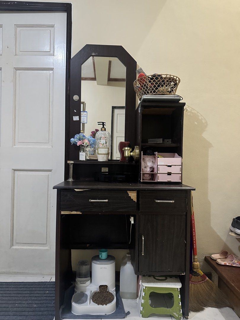 Wooden Dressing Table with Mirror (Category: Tables & Sets) located in Paranaque City. Submitted by moonbea (Listing ID 1435454218, Image 1). Description: - things inside not included -Wooden dressing table with mirror - Includes a drawer, cabinet, and shelves for storage - Dark brown finish - Built-in mirror - Additional side storage - Built in lamp (changeable bulb) .