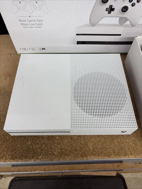 Xbox One S 1TB Console with Two Controllers (Category: Xbox) located in New Bataan. Submitted by newgem.15937b (Listing ID 1435340741, Image 3). Description: Xbox One S 1TB console with two white controllers. Includes the original box and all the accessories. The console and controllers are white. Comes with the necessary cables. Ready to play..
