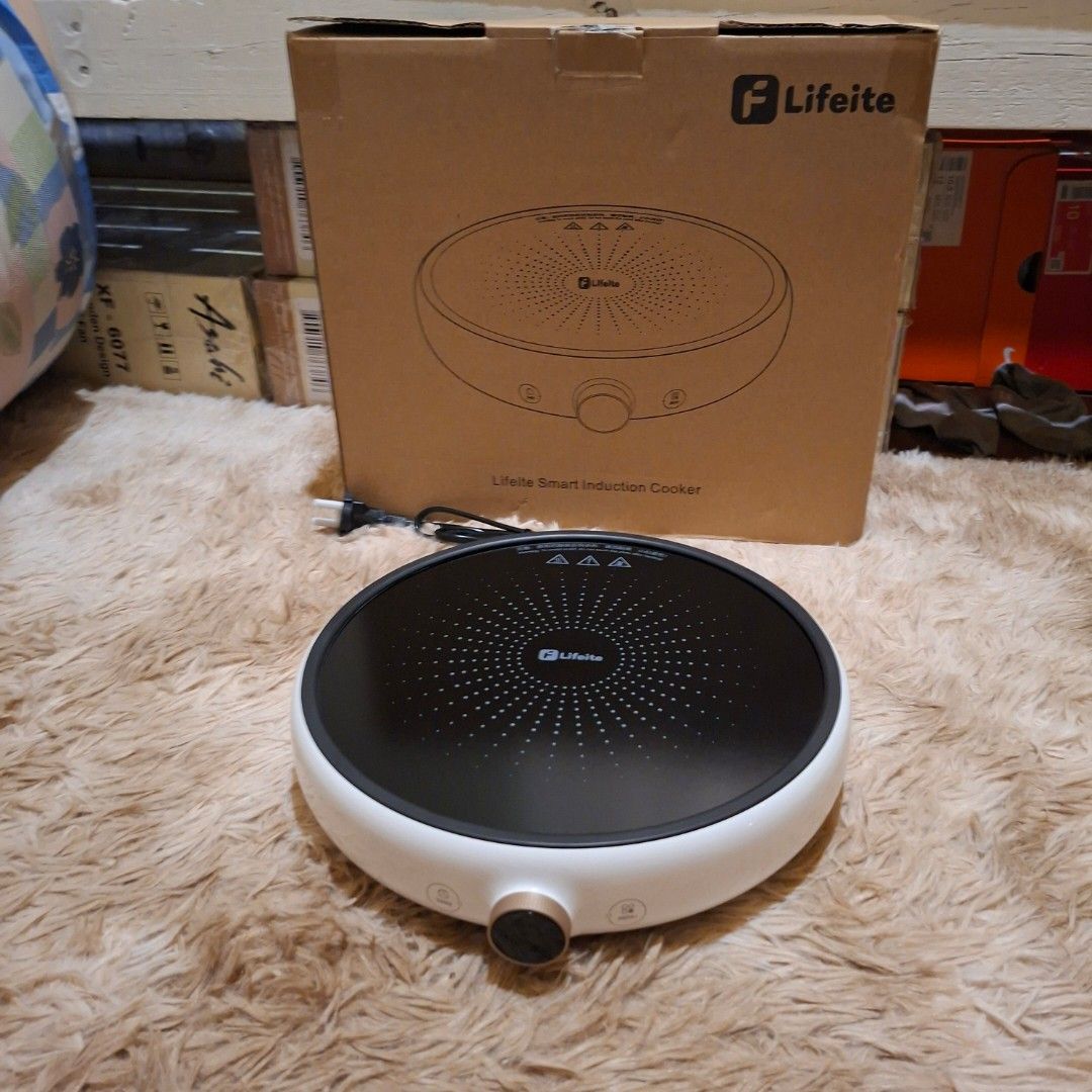 Xiaomi oled knob Lifeite Smart Induction Cooker (Category: Cookers) located in Pasig City. Submitted by mr.bargaindeal (Listing ID 1435396162, Image 3). Description: - Lifeite Smart Induction Cooker - Stylish white and black design - Central cooking surface - Features a control knob and indicator lights - Compact and modern appliance - Comes with the original box.