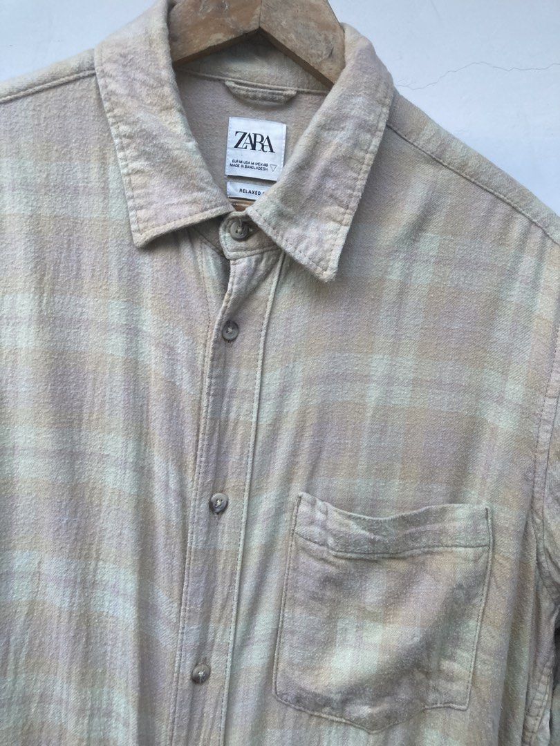 Zara Plaid Long Sleeve Shirt (Category: Tshirts & Polo Shirts ) located in Tacloban City. Submitted by sid1999 (Listing ID 1435430139, Image 2). Description: - Zara long sleeve shirt - Plaid pattern - Button-down closure - Collared neckline - Chest pocket - Neutral color palette - Classic fit Dimension 24 with 30 length.