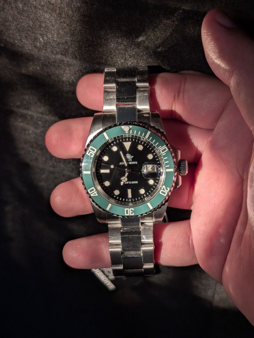Addiesdive Diver's Watch with Green Bezel (Category: Men's Watches) located in Quezon City. Submitted by watchalternativeph (Listing ID 1437205344, Image 3). Description: - Addiesdive diver's watch - Black dial with green bezel - Stainless steel bracelet - Date display - Water-resistant to 200M with screw down crown - Includes original box warranty card.