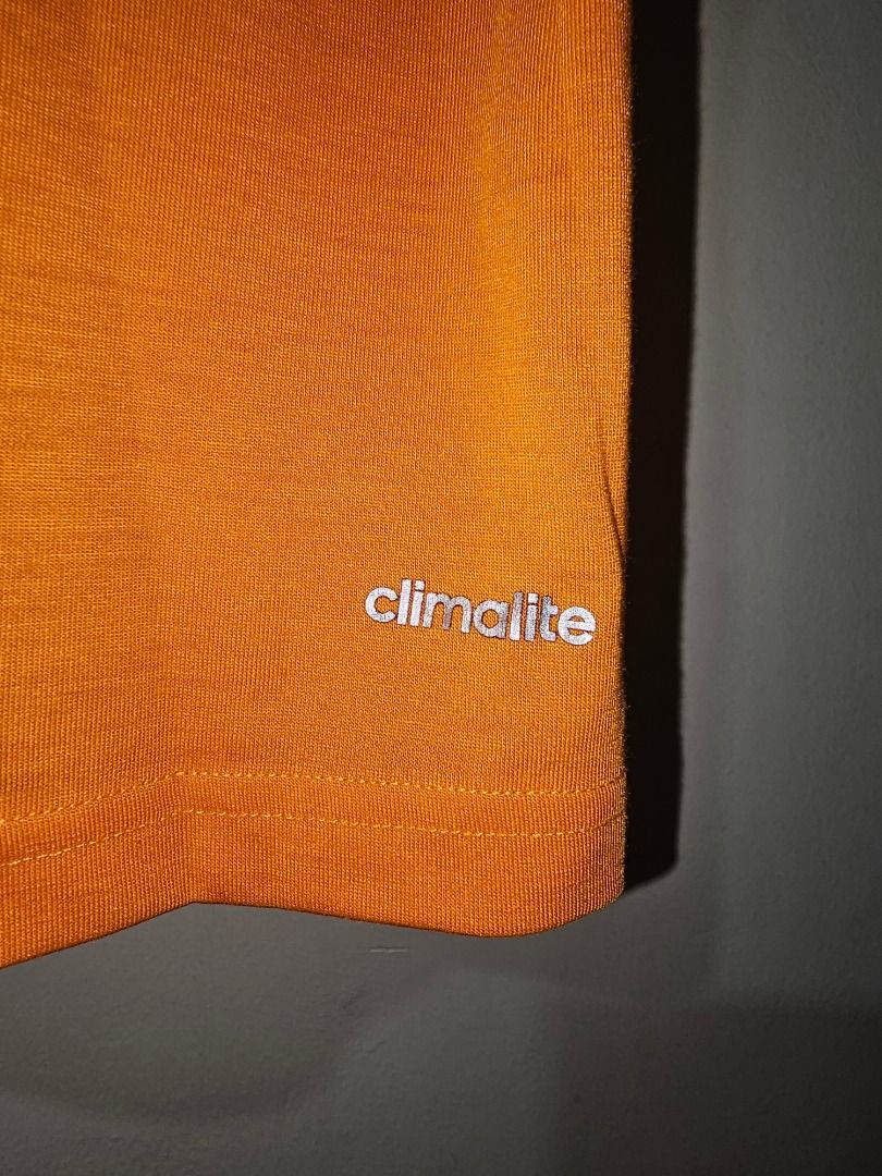 Adidas Climalite Orange T-shirt (Category: Activewear) located in Pasig City. Submitted by cosmicdeer_01 (Listing ID 1437137151, Image 2). Description: W: 20 in L: 27 in Meetups: SM Marikina, Ayala Malls Feliz, Gateway Cubao, SM Megamall.