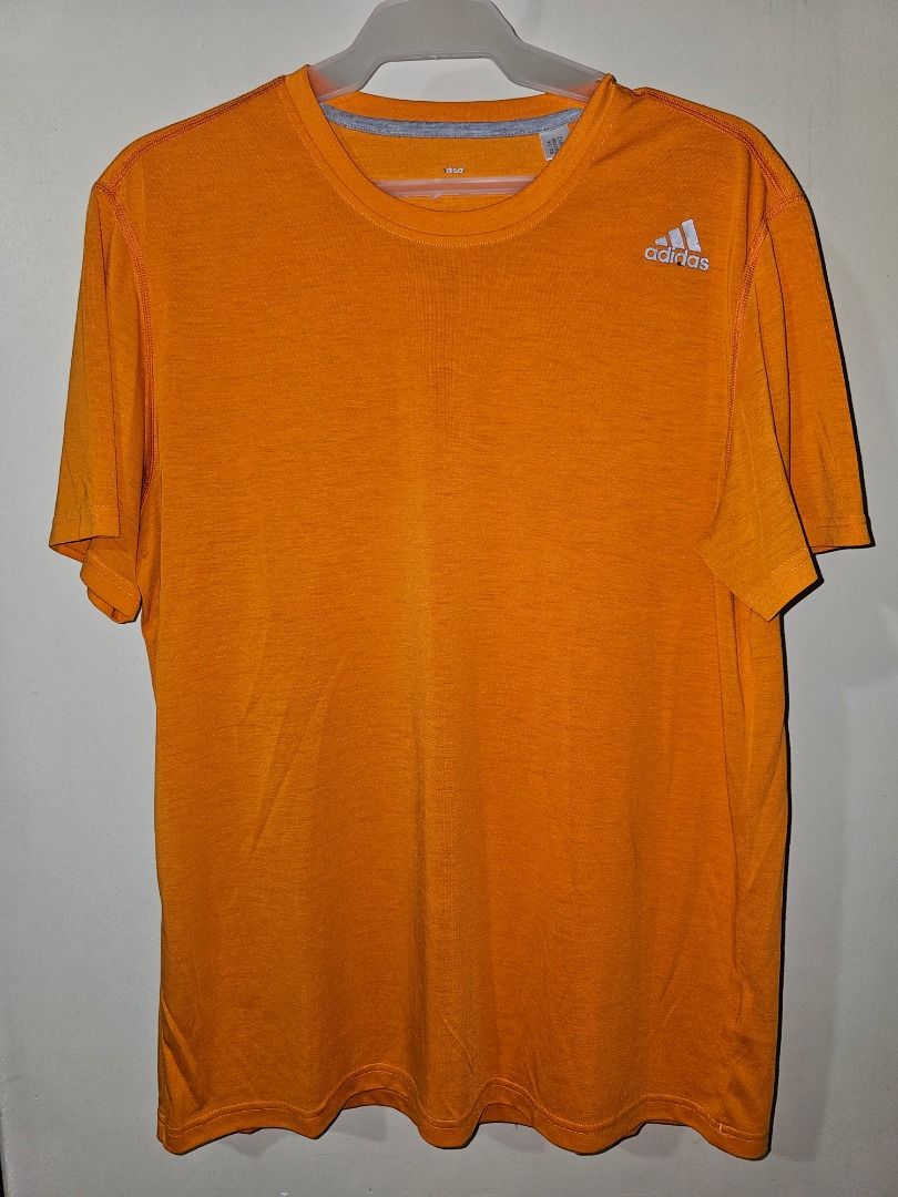 Adidas Climalite Orange T-shirt (Category: Activewear) located in Pasig City. Submitted by cosmicdeer_01 (Listing ID 1437137151, Image 3). Description: W: 20 in L: 27 in Meetups: SM Marikina, Ayala Malls Feliz, Gateway Cubao, SM Megamall.