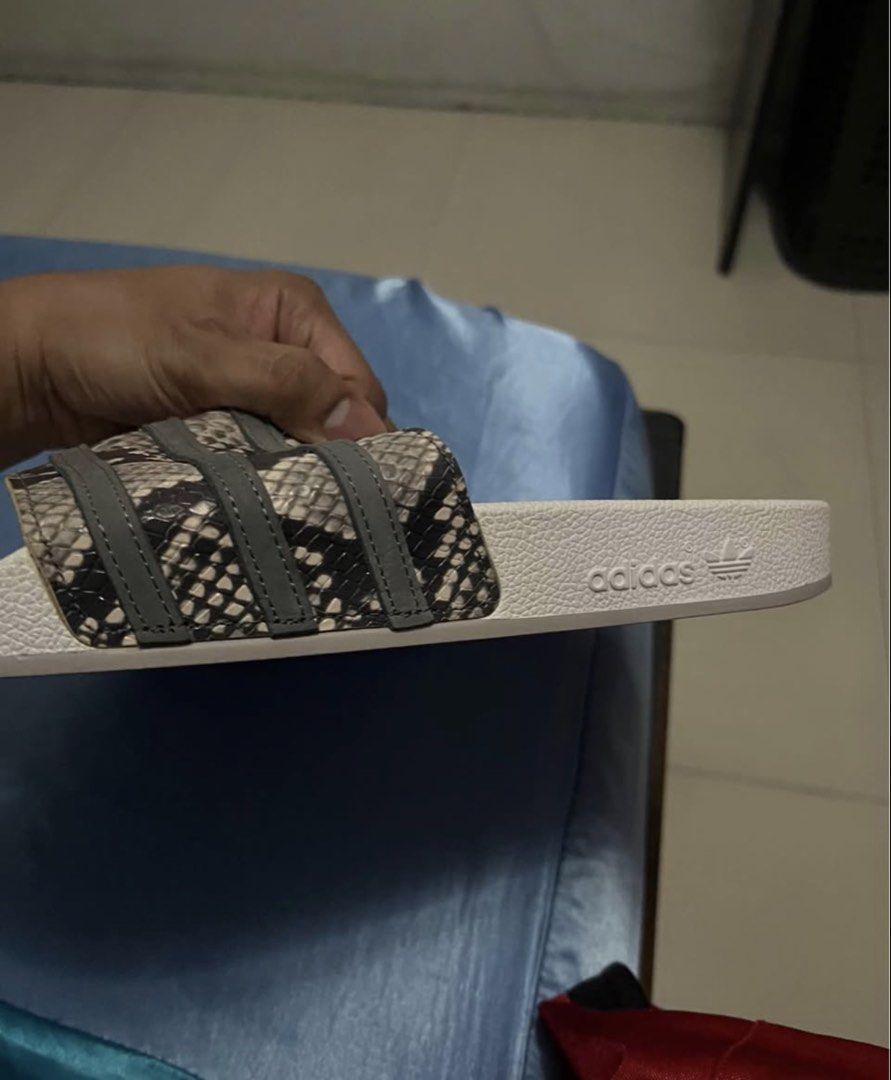 Adidas Slides Snake Print Size 11 (Category: Slippers & Slides) located in Quezon City. Submitted by jdlshop (Listing ID 1437134029, Image 2). Description: - Adidas slides - Snake print straps - White sole with Adidas logo - Size 11 - Unworn.
