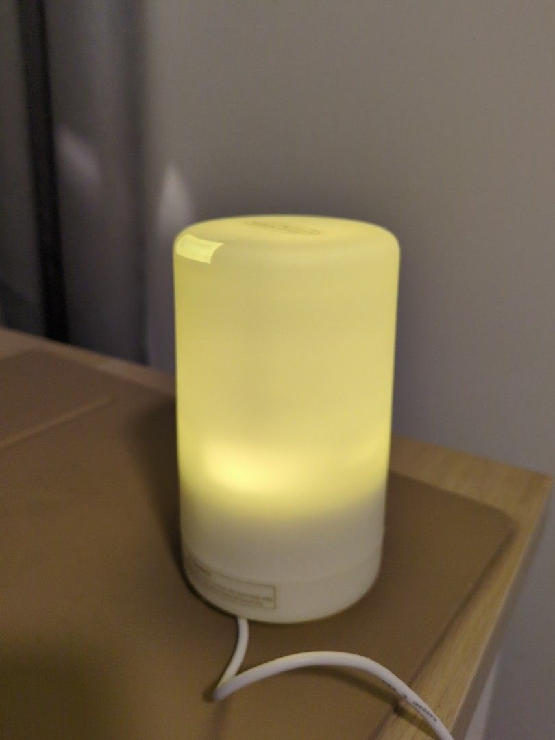 Aroma Diffuser (Category: Home Fragrance) located in Singapore. Submitted by bewtan (Listing ID 1437153703, Image 1). Description: - Iuiga aroma mist diffuser - White, cylindrical design - Includes original packaging - Comes with USB cable - User manual included - Ideal for home or office use - Creates a relaxing environment.