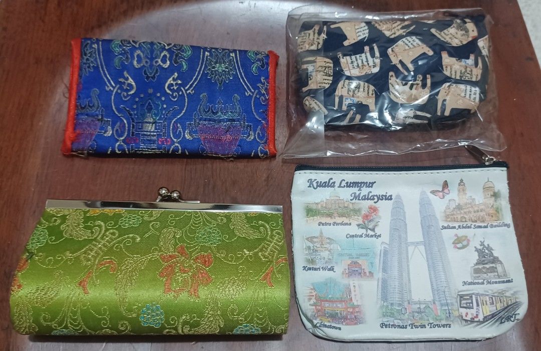 Assorted Coin Purses (Asian Inspired) (Category: Purses & Pouches) located in Quezon City. Submitted by wjmae (Listing ID 1437124702, Image 2). Description: - Coin purse collection with assorted Asian inspired designs. - Includes: - Blue purse with red clasp - Green purse with clasp - Blue purse with elephant prints - Kuala Lumpur-themed purse - Made of fabric. - Different shapes and sizes. - Ideal for coins, cards, or small items..