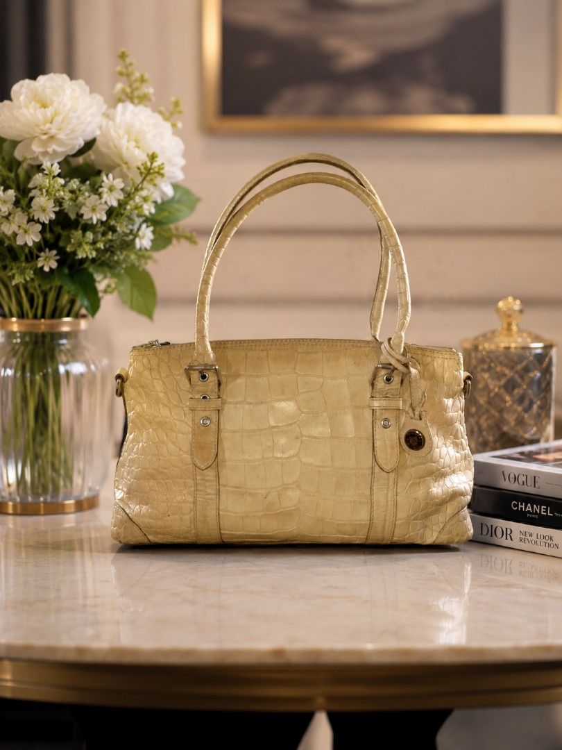 Sale!!! Auth Dooney & Bourke Crocodile Embossed (Category: Luxury Bags & Wallets) located in Davao. Submitted by purple_stitch87 (Listing ID 1437038523, Image 1). Description: excellent condition riri zipper no sling strap.