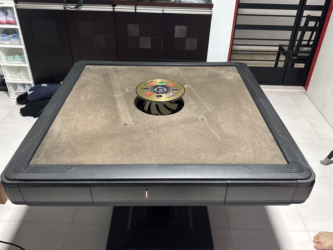 Automatic Mahjong Table (Category: Tables & Sets) located in Singapore. Submitted by justsellingthingsidn (Listing ID 1437147913, Image 1). Description: 2years usage 3rd gen table rollercoaster shuffle comes w free tiles can come and view table good condition .