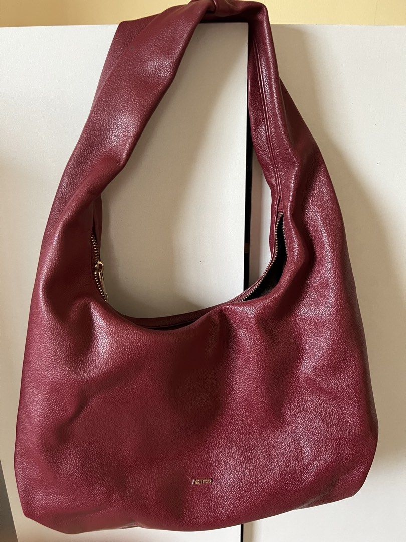 Aztrid Medium Hobo Bag (Category: Luxury Bags & Wallets) located in Manila. Submitted by wsangelescloset (Listing ID 1437125080, Image 1). Description: Broken zipper, not noticeable naman when worn. Body of the bag is 100% good..