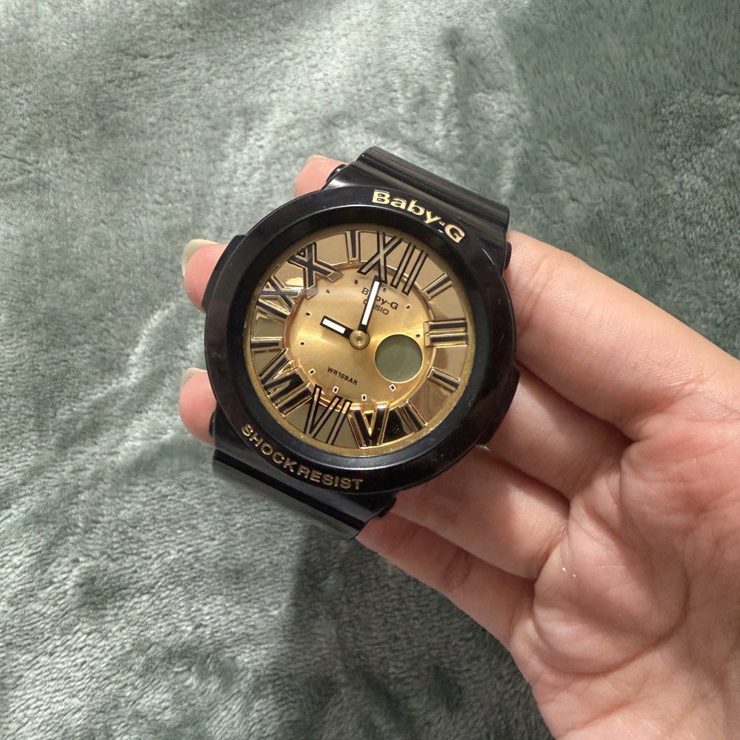 Baby-G Shock Resistant Watch (Category: Women's Watches) located in Manila. Submitted by prelovedbycesca (Listing ID 1437067591, Image 2). Description: - Two Original Baby-G watches are available. - One features a gold-tone dial with Roman numerals and a black strap (Never been used, it was gift) ₱2.5k - The other watch has a black case with pink accents on the dial (preloved) ₱1.5k - Need to change batteries - Can do meetups/delivery.