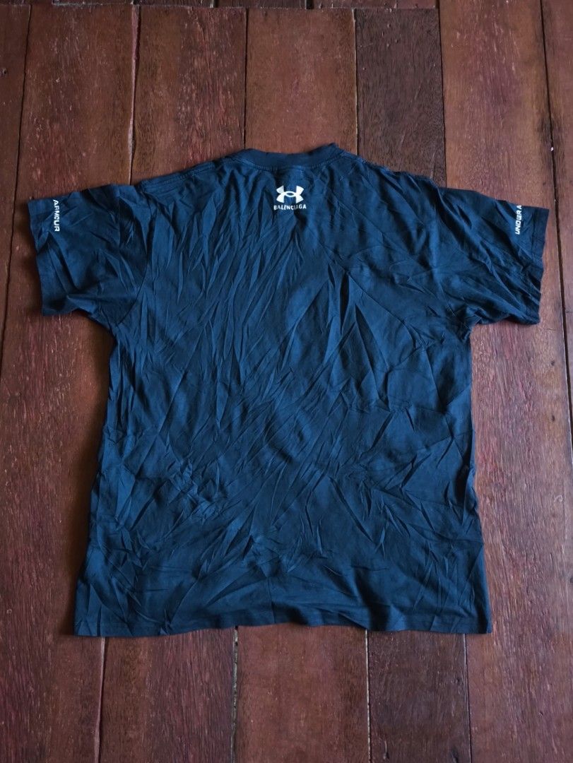 Balenciaga Under Armour T-shirt (Category: Tshirts & Polo Shirts ) located in Dapitan. Submitted by roxfranz714 (Listing ID 1437045501, Image 2). Description: - Black Balenciaga T-shirt - Features Under Armour logo (front and back) - Made in Portugal - Crew neck - Short sleeves - Balenciaga logo on inner tag legit/off 25x33.