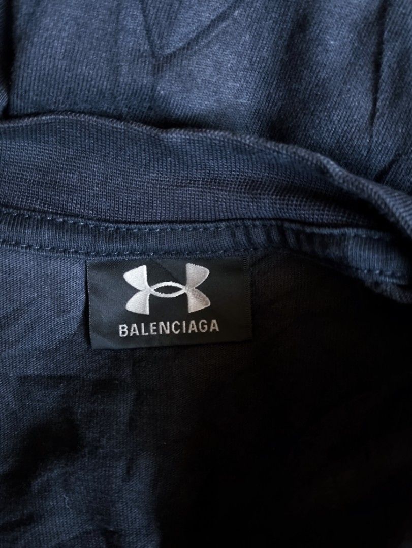 Balenciaga Under Armour T-shirt (Category: Tshirts & Polo Shirts ) located in Dapitan. Submitted by roxfranz714 (Listing ID 1437045501, Image 3). Description: - Black Balenciaga T-shirt - Features Under Armour logo (front and back) - Made in Portugal - Crew neck - Short sleeves - Balenciaga logo on inner tag legit/off 25x33.