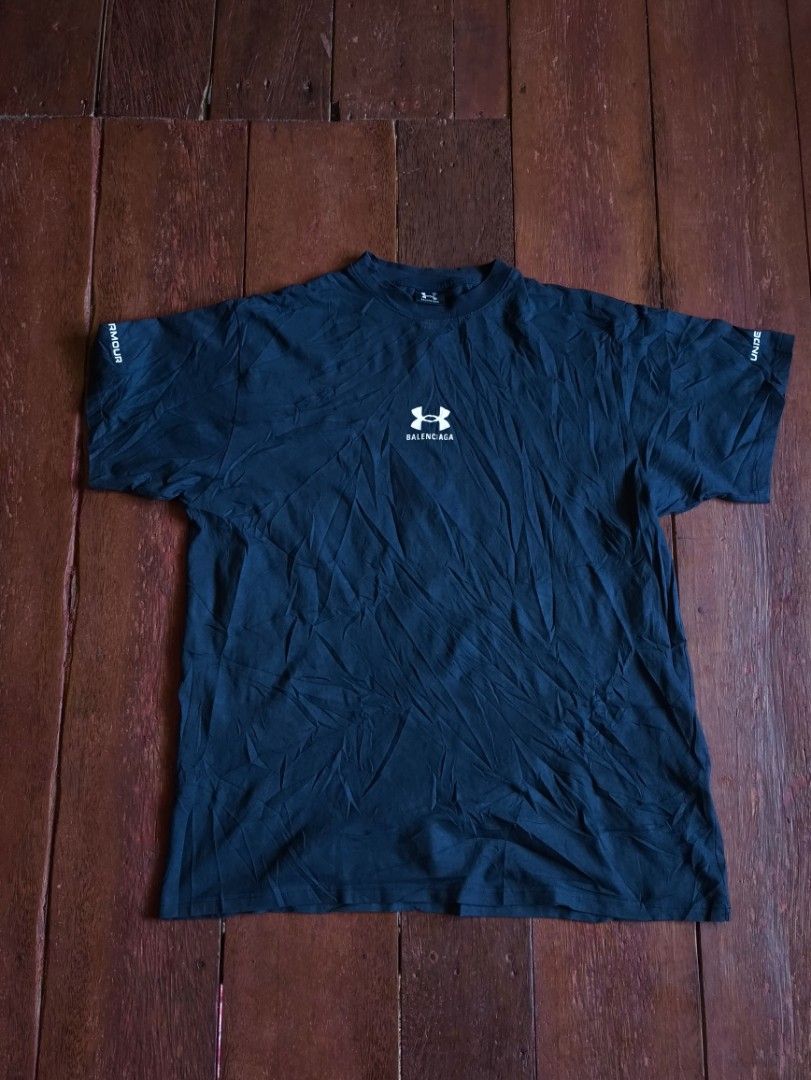 Balenciaga Under Armour T-shirt (Category: Tshirts & Polo Shirts ) located in Dapitan. Submitted by roxfranz714 (Listing ID 1437045501, Image 1). Description: - Black Balenciaga T-shirt - Features Under Armour logo (front and back) - Made in Portugal - Crew neck - Short sleeves - Balenciaga logo on inner tag legit/off 25x33.