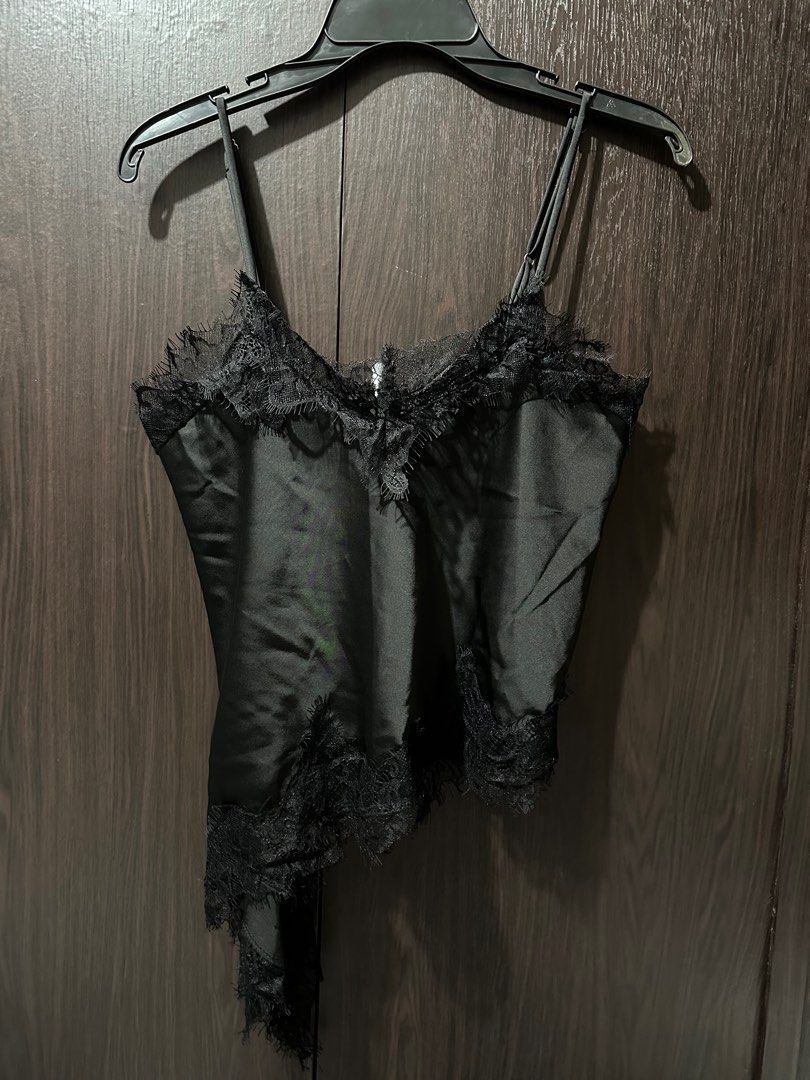 Black Satin Lace Trim Top (Category: Sleeveless) located in Makati City. Submitted by sohdeclutters_ (Listing ID 1437135238, Image 1). Description: - Black satin top - Delicate lace trim - Spaghetti straps - Asymmetrical hemline - Subtle sheen - Perfect for layering - Versatile for casual or dressy wear.